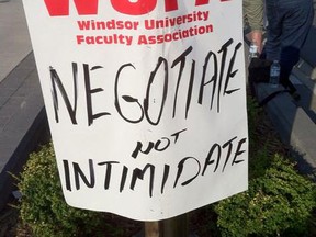 A placard at WUFA's rally on Aug. 21, 2014. (Dalson Chen / The Windsor Star)