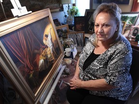 Lepa Marentette, 78, is shown with some of her paintings on Wednesday at  her Windsor home. Her work will be features at the Walkerville Artist Co-op. (DAN JANISSE / The Windsor Star)