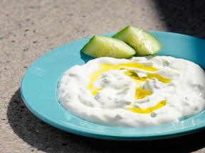 That small bowl of tzatziki sauce sure looks tasty. But two tablespoons delivers 2.5 grams of saturated fat. (MARK VAN MANEN / Postmedia News files)