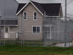 This is the view south-bound motorist on Manning Road have when approaching North Rear Road Tuesday September 2, 2014. Layers of chain link fencing, barbed wire and tight security at medical marijuana facility located at 20 North Rear Road at the intersection with Manning Road Tuesday September 2, 2014.  (NICK BRANCACCIO/The Windsor Star)  (NICK BRANCACCIO/The Windsor Star)