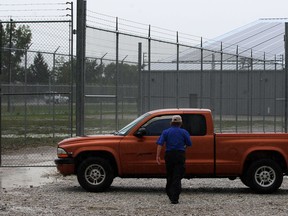 Plenty of chain link fencing topped with barbed wire and tight security at the CEN Biotech medical marijuana facility located at 20 North Rear Road at the intersection with Manning Road Tuesday September 2, 2014.  (NICK BRANCACCIO/The Windsor Star)