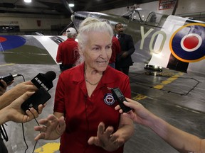 Karen Billing, wife of RAF pilot Jerry Billing speaks to the media during the unveiling of a replica a Mark IX Spitfire circa 1944, an exact replica of the plane Jerry Billing flew into battle in 1944, during a ceremony at Essex Memorial Arena, Thursday September 4, 2014. (NICK BRANCACCIO/The Windsor Star)