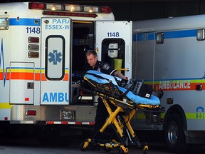 In this file photo, Essex-Windsor EMS paramedics at Windsor Regional Hospital's Ouellette Avenue campus Monday September 08, 2014. Paramedics wearing protective latex suits, goggles and masks brought a patient to the facility with possible Ebola virus symptoms. (NICK BRANCACCIO/The Windsor Star)