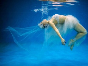 This photo shows Leng Yuting, 26, posing underwater for her wedding pictures at a photo studio in Shanghai, ahead of her wedding next year. Her fiance Riyang said they had their wedding photographs taken underwater because 'its romantic and beautiful'. Mr Wedding studio owner, Tina Lui, started providing underwater pictures four years ago. (JOHANNES EISELE/AFP/Getty Images)