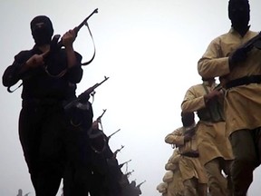 A file picture taken from a video released on January 4, 2014 by the Islamic State of Iraq and the Levant (ISIL)'s al-Furqan Media allegedly shows ISIL fighters marching at an undisclosed location. ISIL gunmen seized Mosul, Iraq's second-largest city, on June 10, 2014 as troops threw away their uniforms and abandoned their posts, officials said, in another blow to the Iraqi authorities, who appear incapable of stopping militant advances.  AFP PHOTO / AL-FURQAN MEDIA  --- RESTRICTED TO EDITORIAL USE - MANDATORY CREDIT "AFP PHOTO / AL-FURQAN MEDIA " - NO MARKETING NO ADVERTISING CAMPAIGNS - DISTRIBUTED AS A SERVICE TO CLIENTS FROM FROM ALTERNATIVE SOURCES, THEREFORE AFP IS NOT RESPONSIBLE FOR ANY DIGITAL ALTER ----/AFP/Getty Images