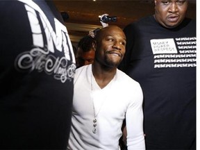 Floyd Mayweather arrives to a promotional event in anticipation to his boxing bout this weekend against Marcos Maidana at the MGM Grand casino-hotel in Las Vegas on Tuesday, Sept. 9, 2014. (AP Photo/Las Vegas Review-Journal, Erik Verduzco)