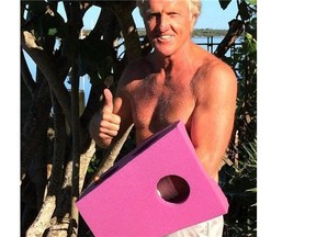 This photo provided by Greg Norman and posted on Instagram on Sunday, Sept. 14, 2014, shows Norman giving the thumbs up with his left hand protected by a purple foam after a chainsaw accident. The Hall of Fame golfer and entrepreneur, was cutting back trees in his South Florida home when the weight of a branch pulled his left hand toward the chain saw. He said the blade hit him just below where a person would be wearing a wrist watch. He said doctors told him it missed his artery by a fraction of an inch. (AP Photo/Courtesy of Greg Norman)