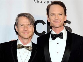 John Cameron Mitchell, left, and Neil Patrick Harris arrive at the 68th annual Tony Awards at Radio City Music Hall on June 8, 2014, in New York. Mitchell remembers vividly exactly where he was when he found out he had died. Or more specifically, when the character he portrayed on Girls met his untimely end. (Associated Press files)