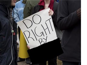 Protesters march near police headquarters in Halifax on April 14, 2013 to draw attention to the death of a teenage girl. The victim can't be named in a child porn case now before the court.
Photograph by: ANDREW VAUGHN/The Canadian Press file