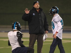 Essex Ravens head coach Glen Mills, centre, runs a practice at Alumni Field. (DAN JANISSE/The Windsor Star)
