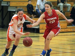 L'Essor's Lauren Golding, left, and Brennan's Kira Hadland battle during high school girls basketball at L'Essor.  (DAN JANISSE/The Windsor Star)