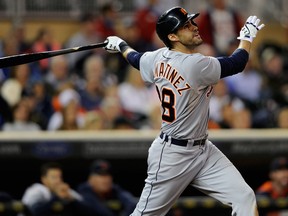 Detroit's J.D. Martinez hits a three-run homer against the Minnesota Twins during the ninth inning Tuesday at Target Field in Minneapolis. (Photo by Hannah Foslien/Getty Images)