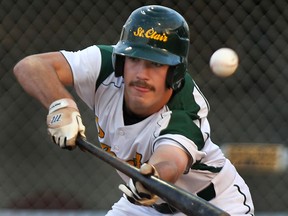 St. Clair College's Chris Horwood bunts Wednesday against Fanshawe at Lacasse Park. (DAN JANISSE/The Windsor Star)