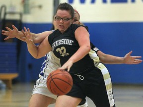 Walkerville's Leslee Ward, left, battles Riverside's Delanie Best during their game Tuesday in Windsor. (DAN JANISSE/The Windsor Star)