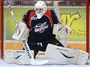 Windsor Spitfires goaltender Alex Fotinos makes a save against the Guelph Storm in Guelph. (Tony Saxon/Guelph Mercury)