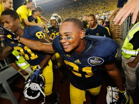 Jeremy Gallon of the Michigan Wolverines celebrates a 41-30 own over the Notre Dame Fighting Irish at Michigan Stadium in 2013. (Photo by Gregory Shamus/Getty Images)