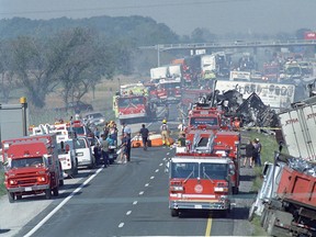 Hundreds of emergency vehicles line Highway 401 following a multi-vehicle pileup along the westbound lanes of Highway 401 just east of Windsor on Sept. 3, 1999. (JASON KRYK/The Windsor Star)