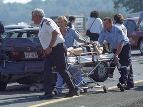 Scene of the Sept. 3 1999 accident on Highway 401 that claimed eight lives. Belle River nurse Jackie Gomes, centre, was heading to work that day. Although she was not injured, she still carries emotional scars. (JASON KRYK/The Windsor Star)