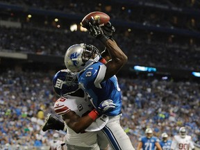 Calvin Johnson #81 of the Detroit Lions can't make a catch against Antrel Rolle #26 of the New York Giants during the third quarter at Ford Field on September 8, 2014 in Detroit, Michigan. (Photo by Joe Sargent/Getty Images)