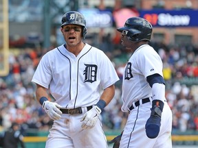 Tigers second baseman Ian Kinsler, left, celebrates with teammate Rajai Davis after hitting a two-run homer in the seventh inning against the Cleveland Indians at Comerica Park on September 14, 2014 in Detroit, Michigan.  (Photo by Leon Halip/Getty Images)