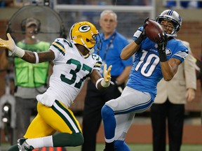 Lions receiver Corey Fuller makes a catch behind Green Bay's Sam Shields at Ford Field on September 21, 2014 in Detroit, Michigan. (Photo by Gregory Shamus/Getty Images)