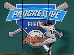 Detroit's Tyler Collins goes after a double by Cleveland's Michael Brantley in the fourth inning Thursday n Cleveland. (AP Photo/Tony Dejak)