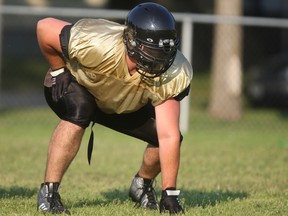 Devin Kozar, 23, practices at the opening of the AKO football camp at Jackson Park, Monday, July 21, 2014.  (DAX MELMER/The Windsor Star)