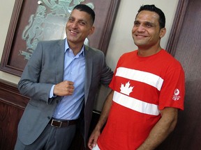 Windsor Mayor Eddie Francis greets Canadian heavyweight boxing champion Samir El-Mais in his office on Friday, Sept. 5, 2014. El-Mais won gold in his division this summer at the Commonwealth Games in Glasgow, Scotland.  (DYLAN KRISTY/The Windsor Star)