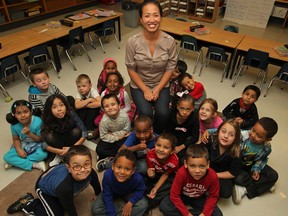 Sophan Bouffa, centre, sits with her senior kindergarten and grade 1 combined class at General Brock Public School, Friday, Sept. 19, 2014.  (DAX MELMER/The Windsor Star)