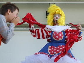 Spencer Charron, 8, covers his mouth in shock as CLaroL The CLown's under garments appear out of nowhere during ClaroL's show at the 20th annual Children's Fest at Derwent Park, Saturday, Sept. 20, 2014.  (DAX MELMER/The Windsor Star)