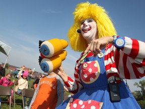 CLaroL The CLown uses her cartoon binoculars to find volunteers during her show at the 20th annual Children's Fest at Derwent Park, Saturday, Sept. 20, 2014.  (DAX MELMER/The Windsor Star)