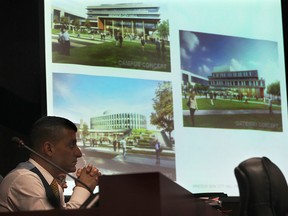 Three conceptual drawings for the new Windsor City Hall are shown at city council on Monday, Sept. 8, 2014, in Windsor, ON. as Mayor Eddie Francis is shown in the foreground. (DAN JANISSE/The Windsor Star)