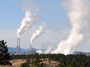 FILE - This Nov. 18, 2008, file photo, shows the Colstrip coal-fired power plant in southeast Montana. Gov. Steve Bullock said Friday, Sept. 19, 2014, that Montana can comply with the Obama administrations climate pollution reduction proposal, even while protecting energy sector jobs and avoiding the closure of coal plants that account for a major share of emissions. (AP Photo/Billings Gazette, James Woodcock, File)  ORG XMIT: MTBIL201