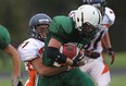 Belle River Nobles runningback Sean Brannagan is tackled by Sandwich Sabres defender Hamzah Iqbal during first half senior high school football action at Sandwich Secondary School in LaSalle, Ontario on September 11, 2014.  (JASON KRYK/The Windsor Star)