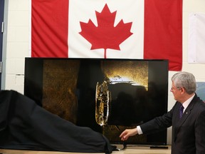Stephen Harper unveils  an image of one of the ships belonging to the ill-fated Franklin Expedition which was lost in 1846, September 9, 2014.   (Jean Levac/Postmedia News)