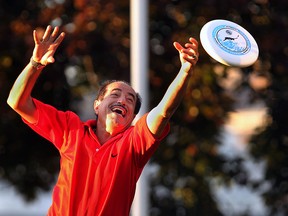 Thair Bihnam enjoys the late afternoon sun Thursday, Sept. 25, 2014, at the Dieppe Gardens in Windsor, ON. as he tossed a frisbee around with his wife. (DAN JANISSE/The Windsor Star)