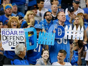 Detroit Lions fans cheer during the third quarter of an NFL football game against the New York Giants in Detroit, Monday, Sept. 8, 2014. (AP Photo/Rick Osentoski)