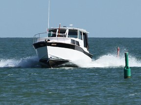 A boat is operated in Lake Erie near Kingsville, Ontario on September 3, 2014.   (JASON KRYK/The Windsor Star)