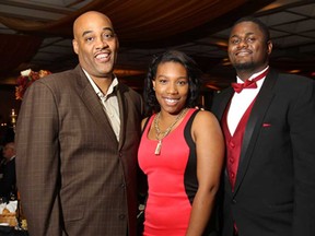 Windsor Express coach Bill Jones (L), Maiyah Peguese and Windsor Express player DeAndre Thomas attended the annual Plentiful Harvest Ball put on by the Unemployed Help Centre on Friday, Sept. 19, 2014, at the Caboto Club in Windsor, ON.  (DAN JANISSE/The Windsor Star)