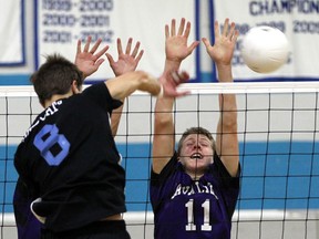 Kingsville's Autian Austin Wilds, right, tries to block a spike from Villanova's Dante Civiero  during senior boys volleyball action at Villanova on September 23, 2014.  (JASON KRYK/ The Windsor Star)