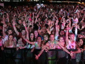 People attend the Homecoming Music Festival at the Riverfront Festival Plaza, Saturday, Sept. 6, 2014.  This year's attraction was Life in Color, dubbed the the world's largest paint party.  (DAX MELMER/The Windsor Star)