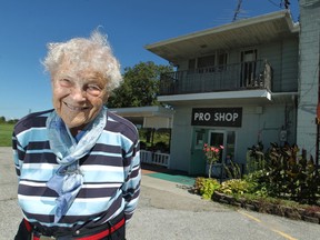 Virginia Panasiuk, 92, is pictured in front of the Pro Shop at Hydeaway Golf Club, Sunday, Sept. 7, 2014, which she opened with her late husband 51 years ago.  The club closed Sept. 21.   (DAX MELMER/The Windsor Star)
