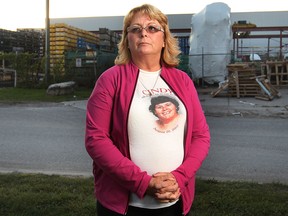 Tammy Lewis is shown in front of the NARMCO Group factory on Tuesday, Sept. 23, 2014 in Windsor, ON. Her sister Cindy Libby was killed in an industrial accident seven years ago at the Prince Metal Products LTD plant. She wants better safety measures to protect workers.   (DAN JANISSE/The Windsor Star)