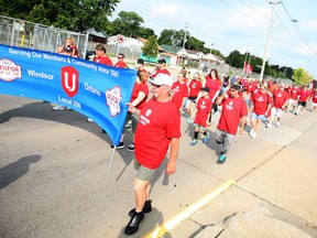 UNIFOR members walk down Walker Rd. for the Labour Day parade, Monday, Sept. 1, 2014.  (DAX MELMER/The Windsor Star)