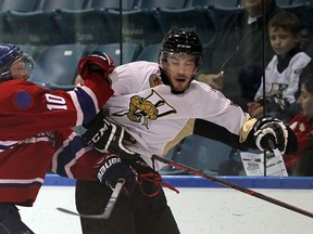 In this file photo, LaSalle Vipers Graham Pickard collides with Strathroy Rockets Matt Laberge during first period Jr. B hockey action at the Vollmer Complex in LaSalle, Ontario on September 17, 2014. (JASON KRYK/The Windsor Star)