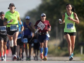 Participants in the 2014 Run for Heroes Marathon make their down Front Rd. North, Sunday, Sept. 21, 2014.  (DAX MELMER/The Windsor Star)