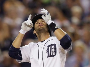 Detroit Tigers' J.D. Martinez looks skyward after hitting a solo home run during the fifth inning of a baseball game against the Kansas City Royals in Detroit, Tuesday, Sept. 9, 2014. The Tigers won 4-2. (AP Photo/Carlos Osorio)