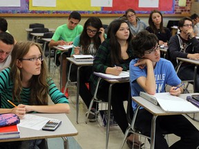 Students in Nicole Rusenstrom's grade 10 math class work on an assignment at General Amherst Hight School in Amherstburg on Wednesday, September 24, 2014.                    (TYLER BROWNBRIDGE/The Windsor Star)
