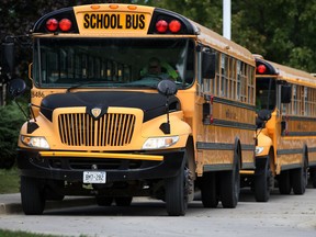 School buses line up outside Notre Dame Catholic School before school is let out, Tuesday, Sept. 9, 2014.  (DAX MELMER/The Windsor Star)