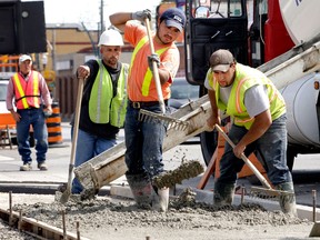 A work crew with Pierascenzi Construction Ltd. installs a new sidewalk at the intersection of Marentette  Ave. and Wyandotte St. E. on April 20, 2010. (Windsor Star files)